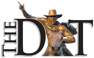 The DT black letters with bronze statue of Will Rogers